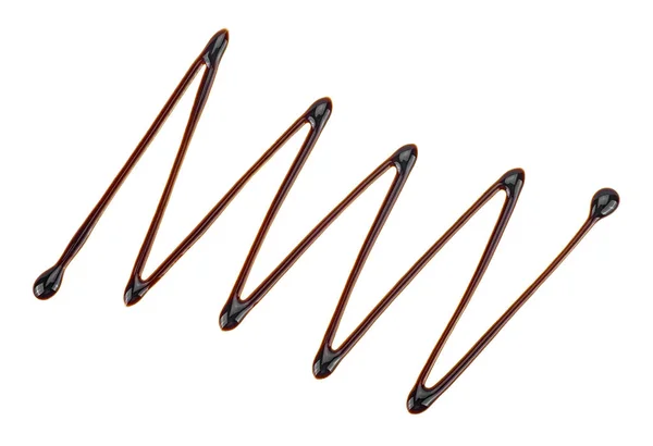 Xarope de chocolate gota isolada no fundo branco. Forma Zigzag . — Fotografia de Stock