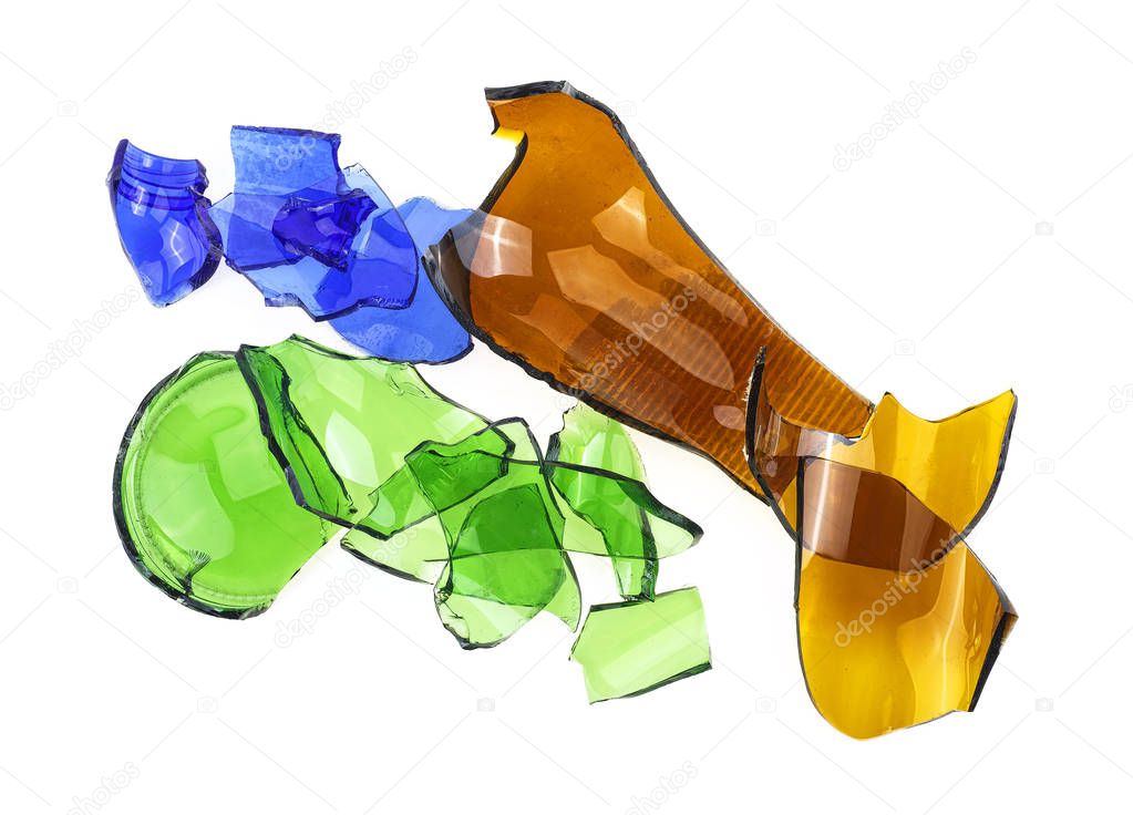 Broken glass - broken colored bottles on a white background.