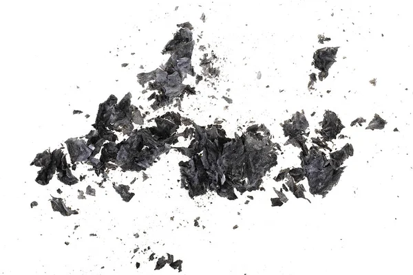Pieces of burnt paper on a white background. The ashes of the pa — Stock Photo, Image