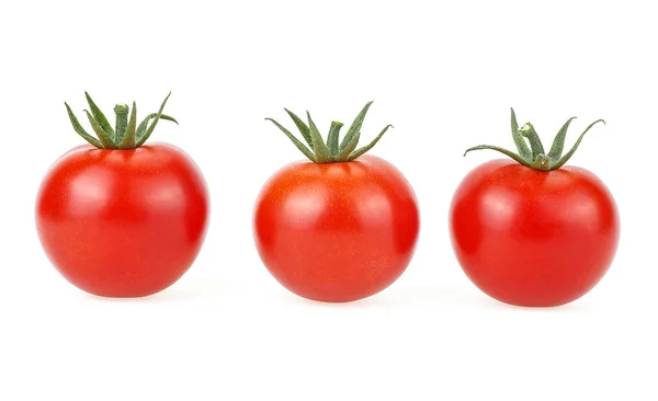 Drie verse tomaten geïsoleerd op een witte achtergrond — Stockfoto