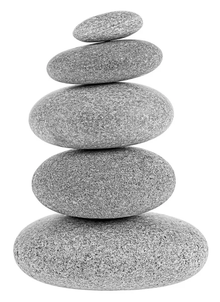 Balancing pebble tower isolated on a white background. Stack of