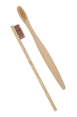 Wooden toothbrush isolated on a white background, top view. Bamb