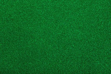 Sparkle of green glitter texture. Christmas background.