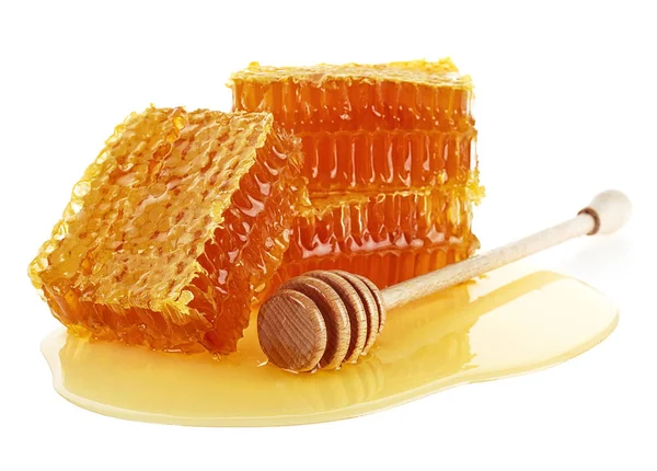 Honeycomb with honey dipper isolated on a white background. Orga — Stok fotoğraf