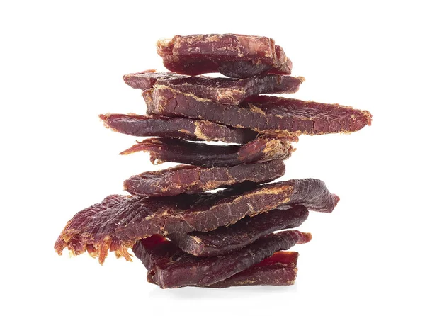 Beef jerky pieces isolated on a white background. Portion of beef jerky