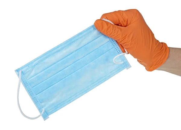 Hand Hand Oranje Handschoen Houdt Een Blauw Medisch Gezichtsmasker Tegen — Stockfoto