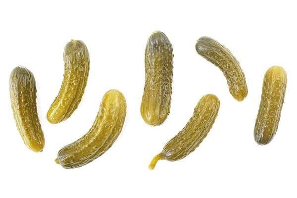 Cornichons - small pickled cucumbers isolated on a white background. Top view.