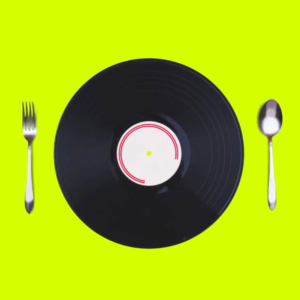 Music mania concept. retro record, spoon & fork isolated on green — Stock Photo, Image