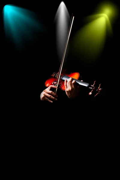 male musician hands playing classical violin in concert