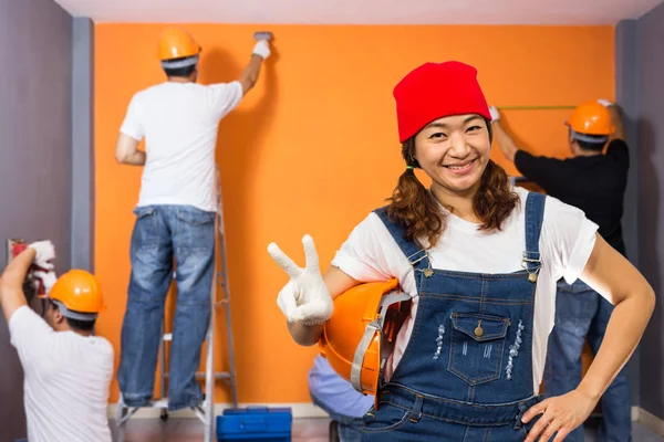 Home improvement , Renovation set. Asian smiling cute female & male craftsman group working indoor — Stock Photo, Image