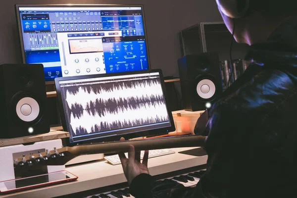 Asian professional musician recording electric guitar in digital studio — Stock Photo, Image