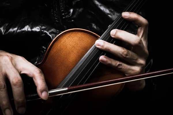 Hands of musician in black jacket posing on classical violin — Stock Photo, Image