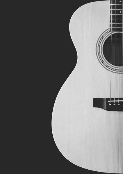 Black and white acoustic guitar showing curve of body shape, isolated on black. music background — Stock Photo, Image