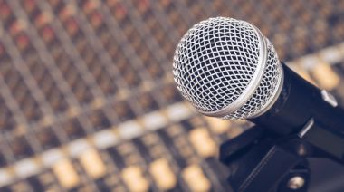 dynamic microphone on audio mixing board clipart