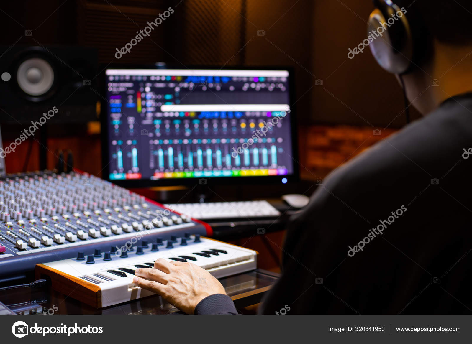 Back Asian Male Music Producer Arranging Song Midi Keyboard Computer Back Asian Male Music Producer Arranging Song Midi Keyboard Computer