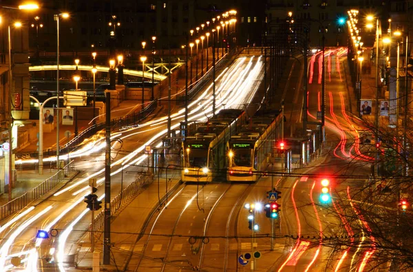 Long exposure view of busy Grand Boulevard with trams Budapest — Stock Photo, Image