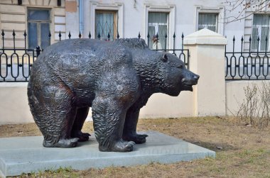 Moscow, Russia, April, 15, 2017. Sculpture of Russian bear with the image of sights of Moscow in the square of Generals at crossing of Potapovsky and Arkhangelsky lanes clipart