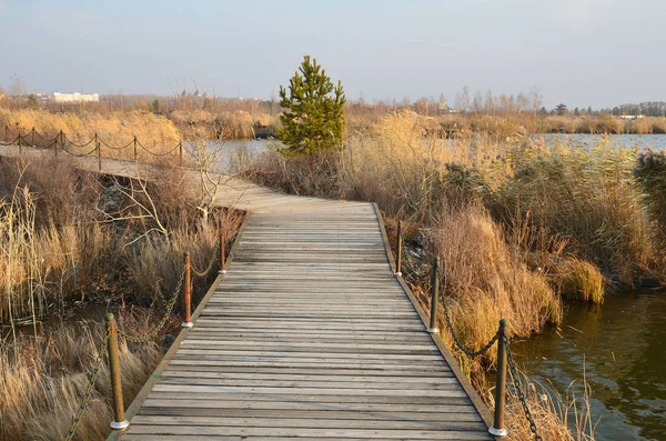 Ecological trail around the lake Yaoquan in Global Geopark in Wudalianchi in Northern China in autumn