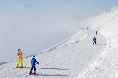 Rosa Khutor, Sochi, Russia, January, 28, 2018, People skiing on ski resort Rosa Khutor fron Rosa Peak during ski slope Goritsvet clipart