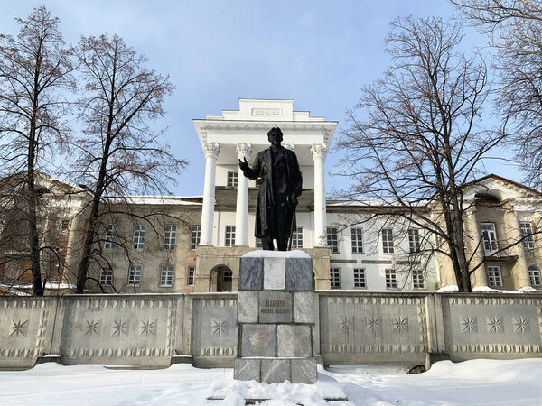 Kyshtym, Russia, February, 06, 2020.  Monument of architecture - Demidov's estate "White house"  in Kyshtym, 18 century and monument to Kalinin.  Russia, Chelyabinsk region