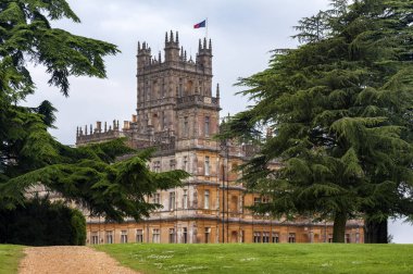 NEWBURY, HAMPSHIRE, ENGLAND - MAY 27 2018: Highclere Castle, a Jacobethan style country house, home of the Earl and Countess of Carnarvon. Setting of Downton Abbey - UK clipart