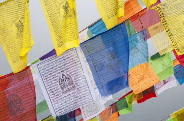 Colorful Tibetan prayer flags at Boudhanath (also called Boudha, Bouddhanath or Baudhanath) which is a buddhist stupa in Kathmandu, Nepal - UNESCO World Heritage Site