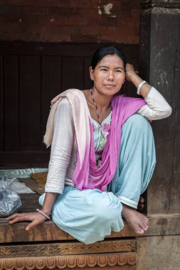 BHAKTAPUR, NEPAL  AUGUST 13, 2018: Unidentified Nepalese woman in Bhaktapur, Nepal, listed as a World Heritage by UNESCO for its rich culture, temples, and wood artwork