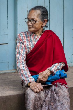 BHAKTAPUR, NEPAL  AUGUST 13, 2018: Unidentified Nepalese woman in Bhaktapur, Nepal, listed as a World Heritage by UNESCO for its rich culture, temples, and wood artwork