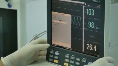 Operating room with modern equipment. Surgeon and surgical tools closeup.