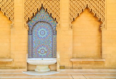Moroccan style fountain with fine colorful mosaic tiles at the M clipart