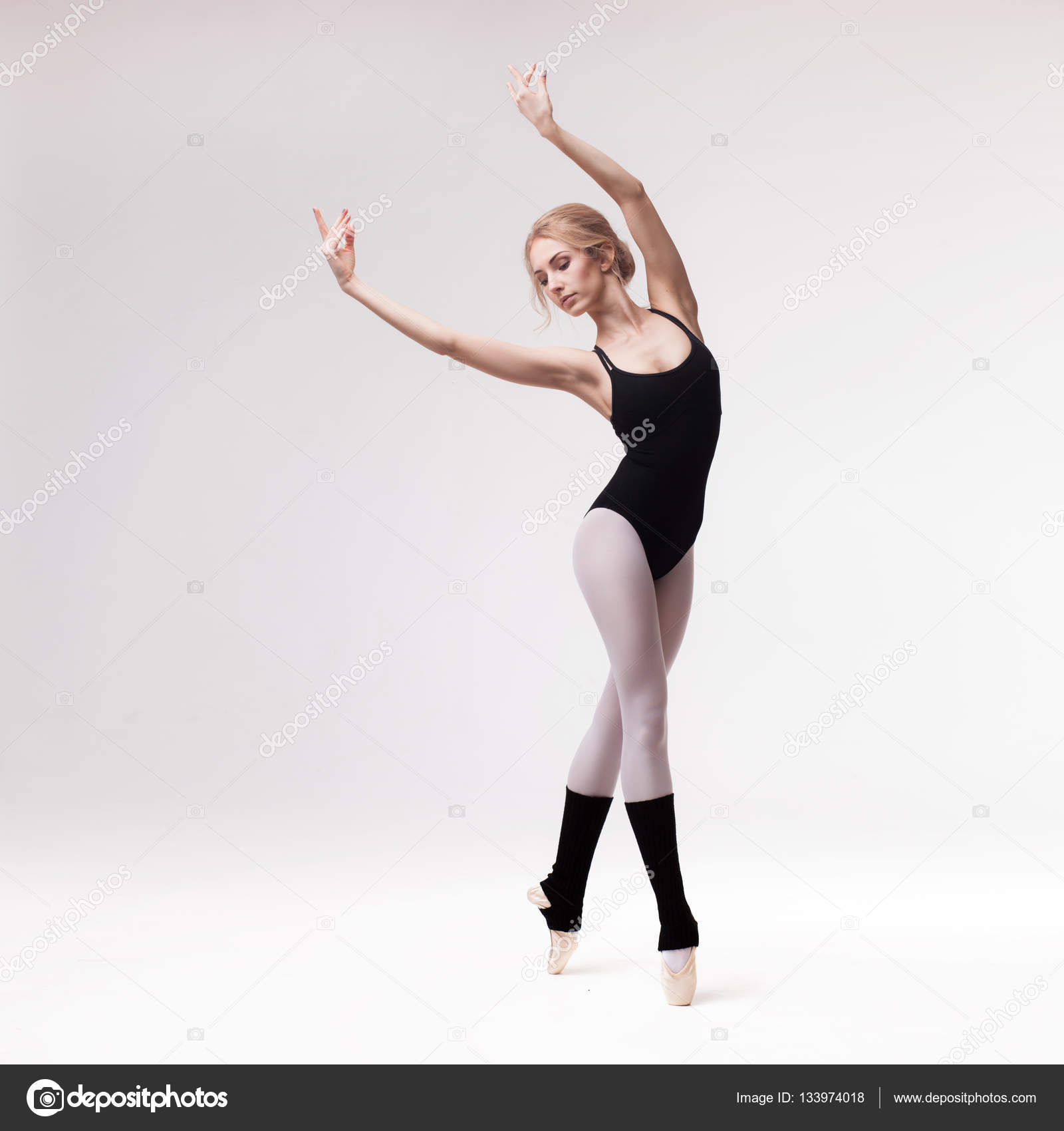 Young Ballerina Demonstrating Pointe Technique on Road - a Royalty Free  Stock Photo from Photocase