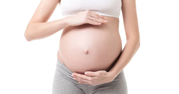 Gros plan de la femme enceinte qui touche son ventre — Photo