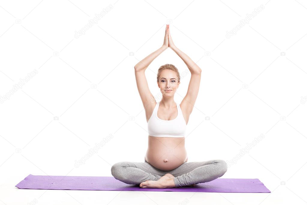 Portrait Of Pregnant Woman Doing Yoga