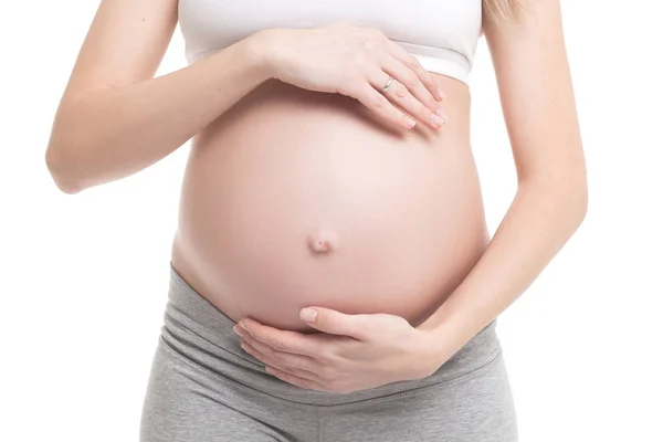 Close-up van zwangere vrouw aanraken haar buik — Stockfoto