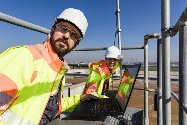 Engineers working on water treatment plant — 스톡 사진