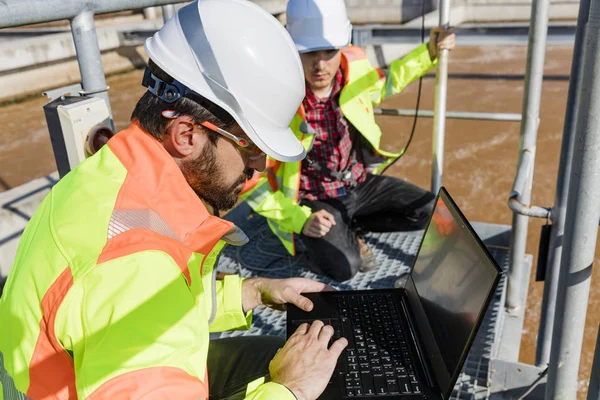 Engineers working on water treatment plant — 스톡 사진