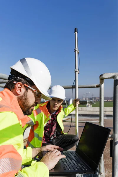 Engineers working on water treatment plant — 스톡 사진