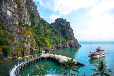 Pier surrounded by limestone karst of Ha Long Bay in Quang Ninh Province, northeast Vietnam clipart