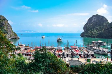 Pier surrounded by limestone karst of Ha Long Bay in Quang Ninh Province, northeast Vietnam clipart