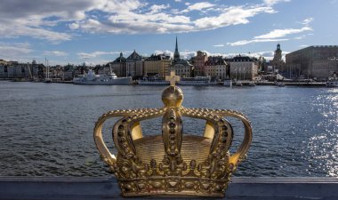 Skeppsholmsbron bridge with golden crown in Stockholm, Sweden - Europe clipart