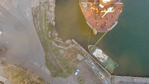 Aerial view of big grain elevators on the sea. Loading of grain on a ship. Port. Cargo ship — Stock Photo, Image