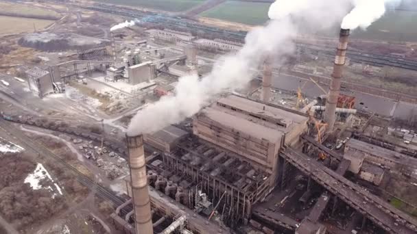 Aerial view. Emission to atmosphere from industrial pipes. Smokestack pipes shooted with drone. Close-up. — Stock Video