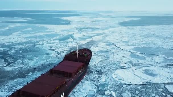 Aerial view. The ship sails through the sea ice in the winter, close-up — Stock Video