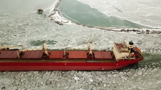 Aerial view. The ship sails through the sea ice in the winter, close-up — Stock Video