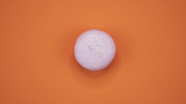 ROTATION: A Colorful Macaroons are rotating on a orange background — Stock Video