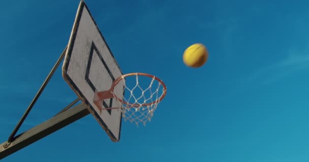 Basketball ball hits the hoop. Closeup. — ストック動画