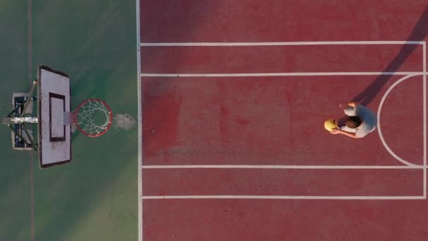 Aerial view. Man playing basketball on the court. — 비디오