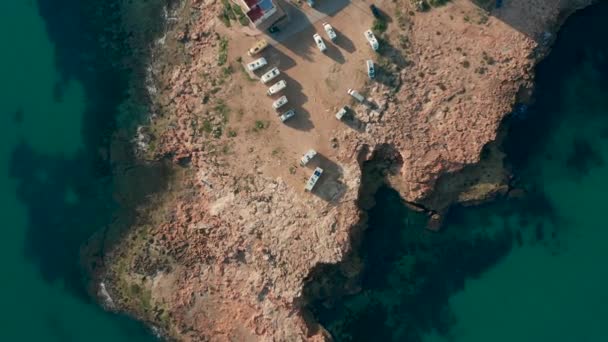 Aerial view. Camping Sites with Modern Motorhome RV Camper Van on a rock near the sea. — Stock Video