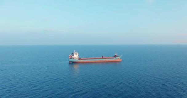 Freight ship floating on sea. Aerial view. — Stock Video