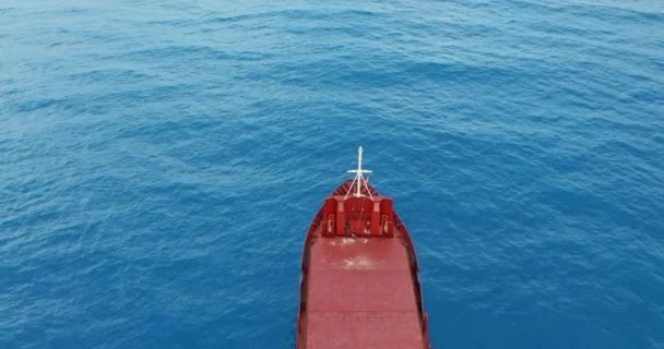 Aerial view. Red deck cargo ship sailing on open sea. — 비디오